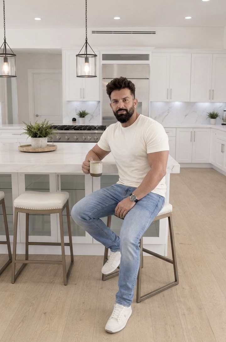 Andy Azadzoi inside a completed modern kitchen